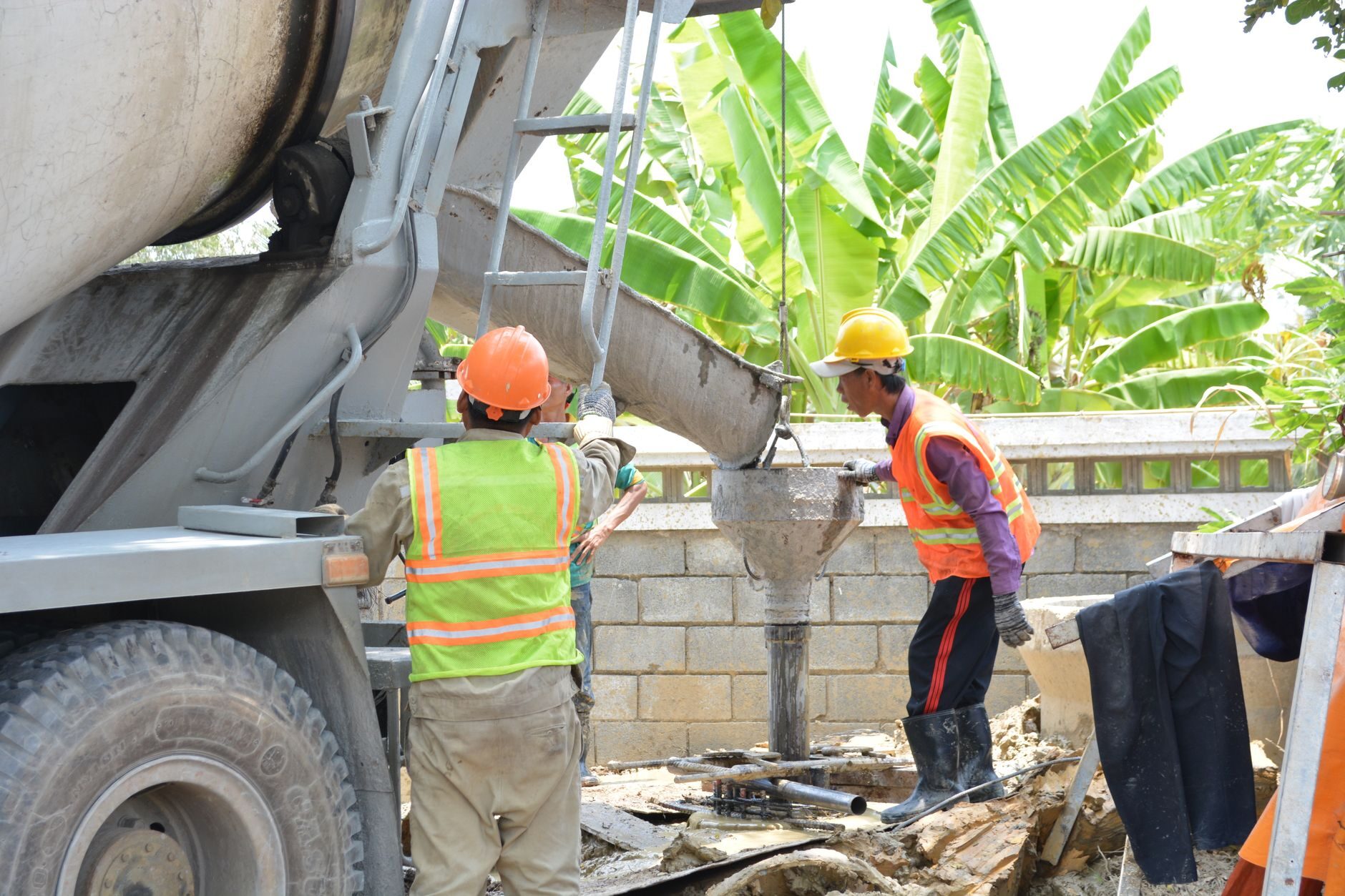 Concrete crew pouring and finishing a slab