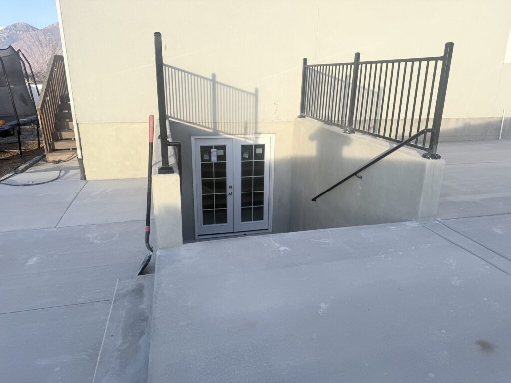 Large concrete pad in a Utah side yard