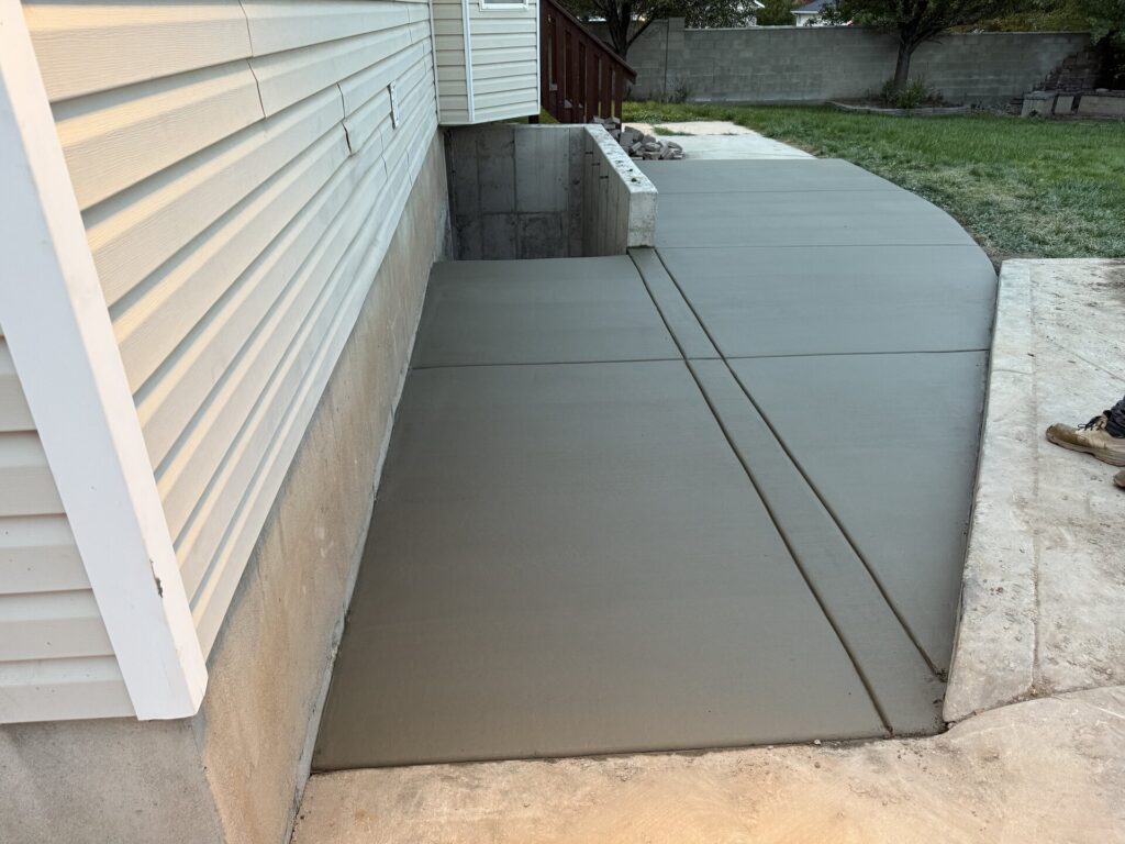 Smooth concrete slab beside a home