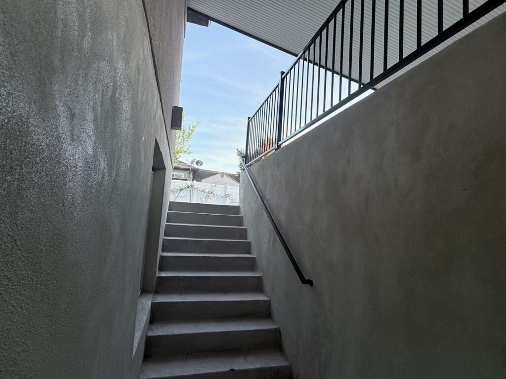 Concrete steps with a metal handrail