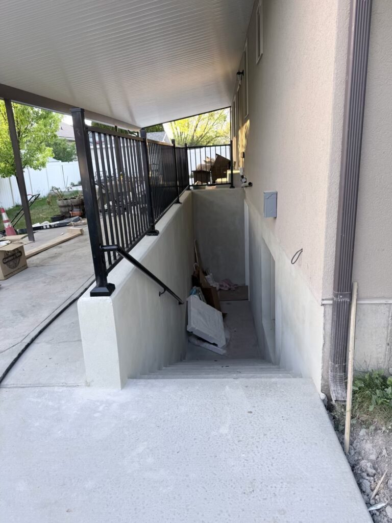 Concrete steps with a retaining wall on a slope