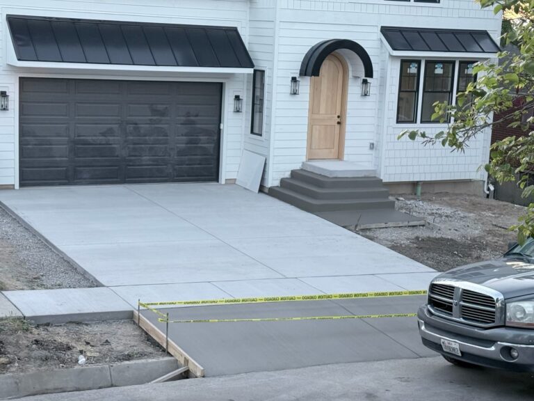 Freshly finished concrete driveway at a Utah home