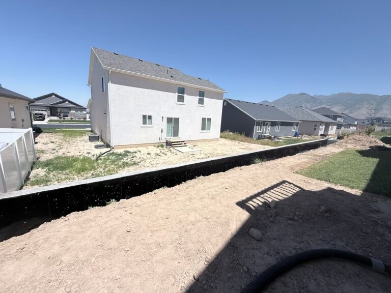 Concrete driveway with decorative border and mountain views