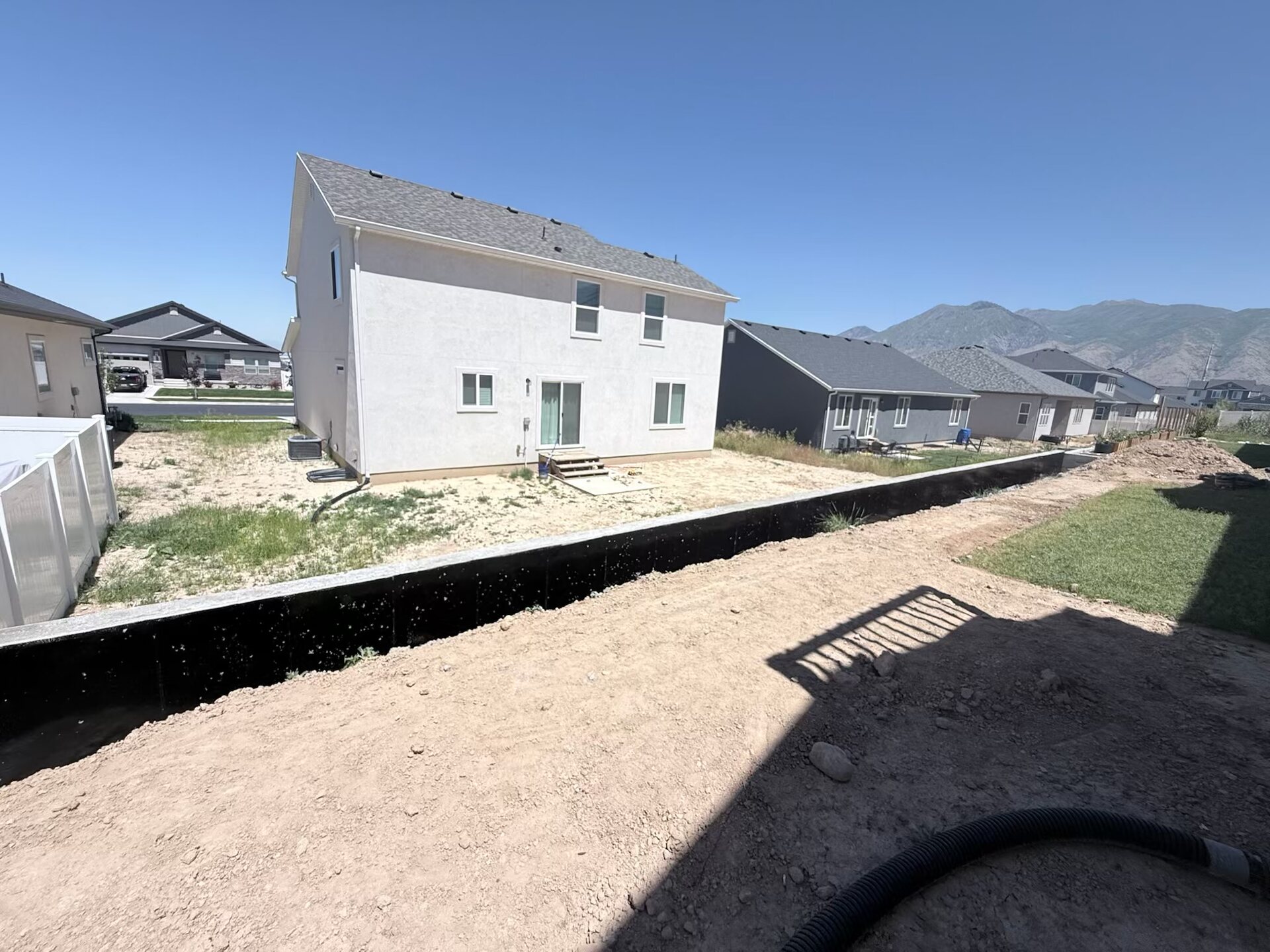 Concrete driveway with decorative border and mountain views